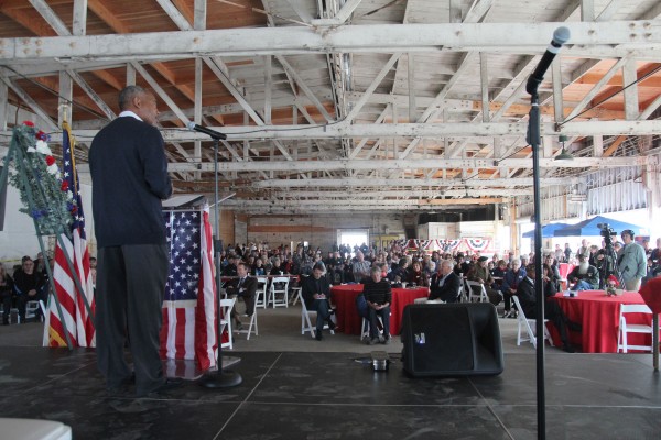 Jeff Wright, Richmond Museum of History board member, emcees the Veteran’s Day event at the Port of Richmond. More than 200 people attended. (Photo by: Kevin N. Hume)